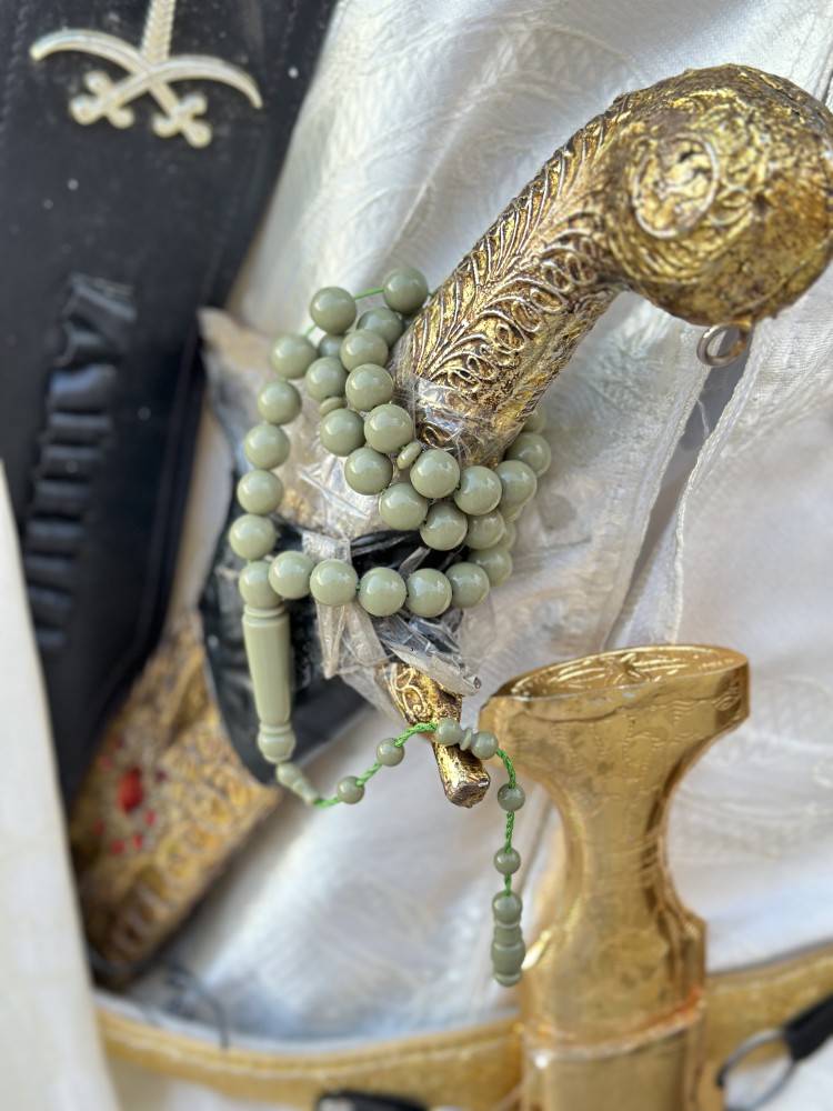 A tasbih with a royal blue and pistachio green color.