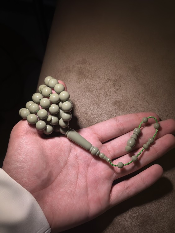 A tasbih with a royal blue and pistachio green color.
