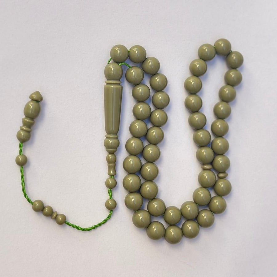 A tasbih with a royal blue and pistachio green color.