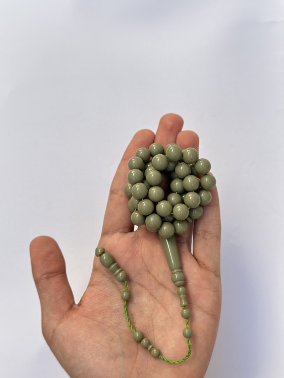 A tasbih with a royal blue and pistachio green color.
