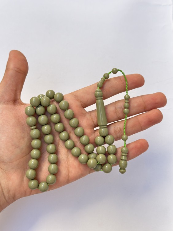 A tasbih with a royal blue and pistachio green color.