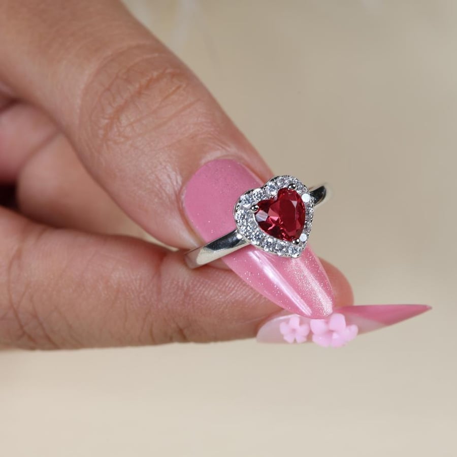 Silver ring with red zircon stone
