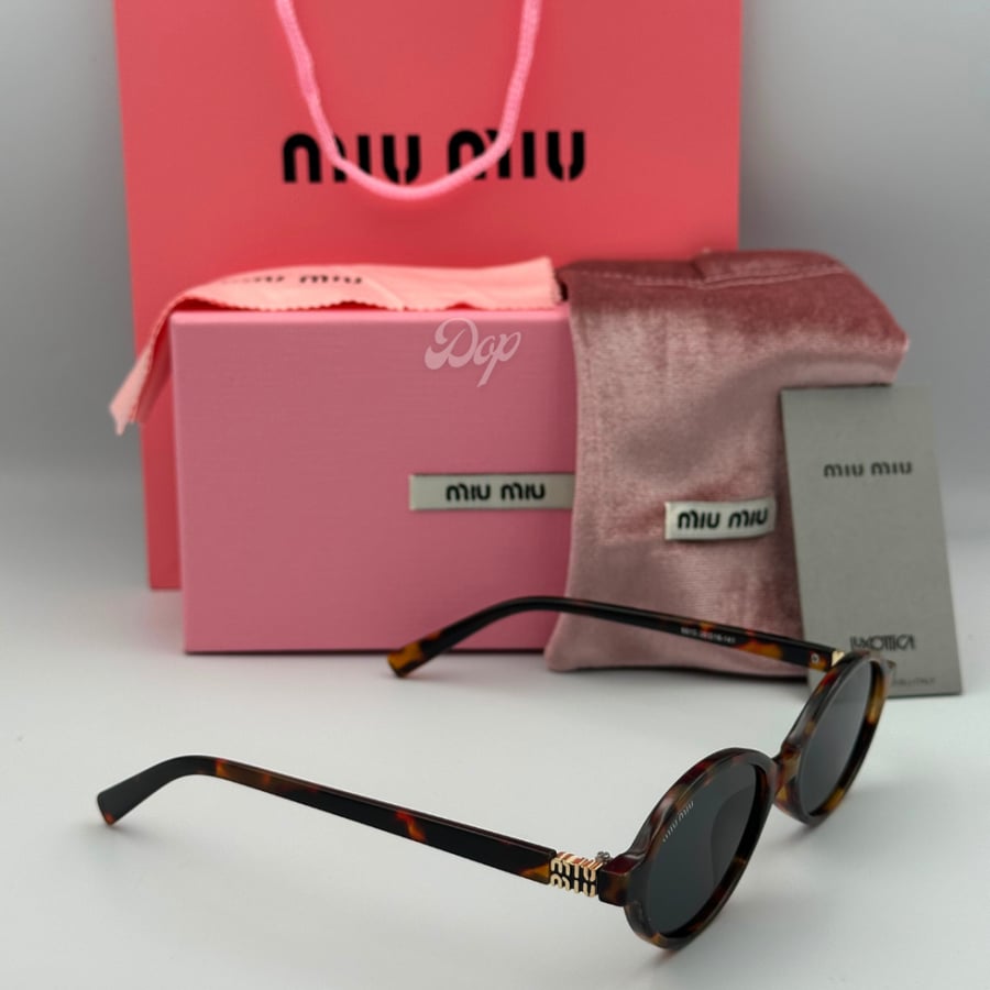 Miu Miu sunglasses with a tiger frame and round black lenses