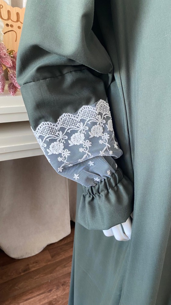 Prayer attire with a green royal hijab