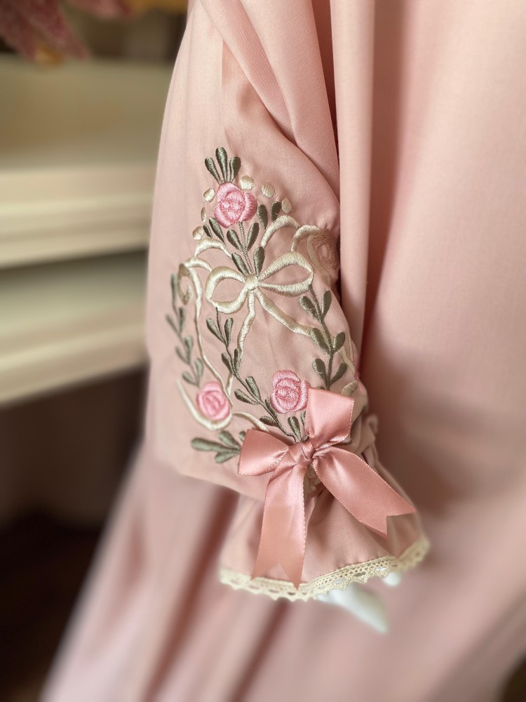 A prayer set with regular style embroidered clothing and a prayer rug
