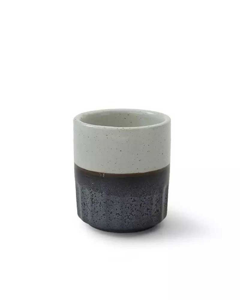 A cup with two colors, gray and white