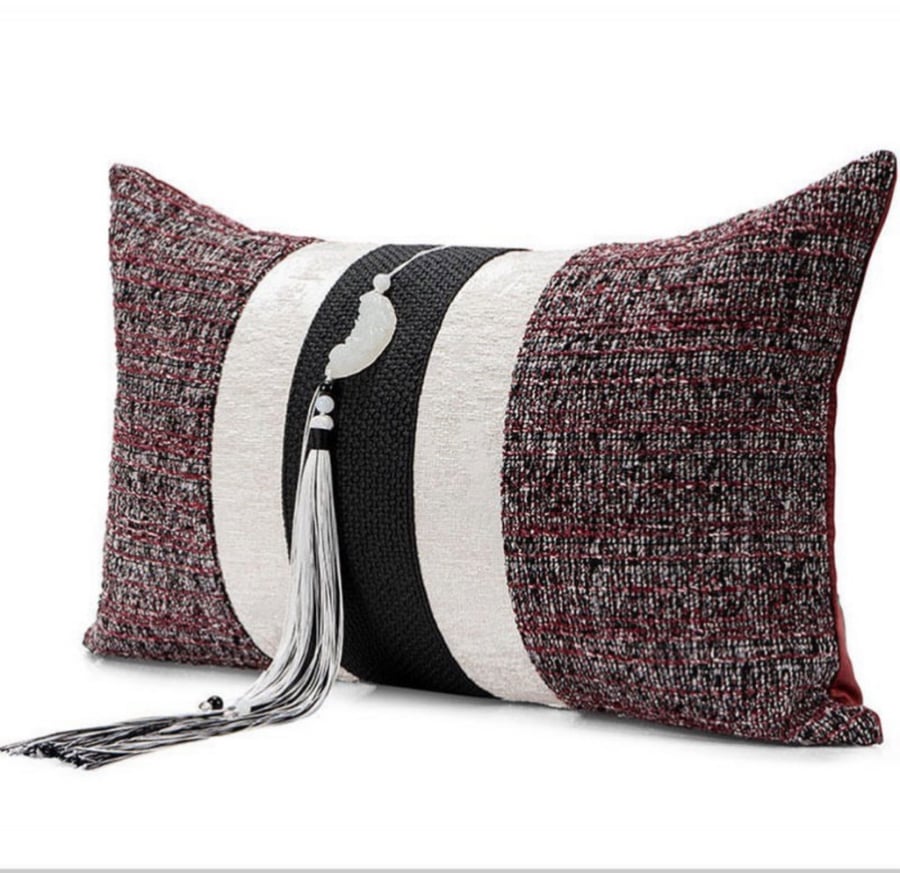 A cushion cover in maroon and black