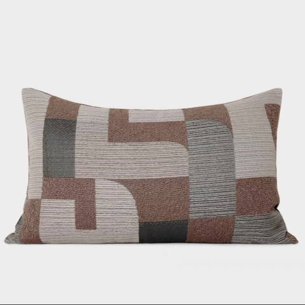 A modern abstract design brown pillow