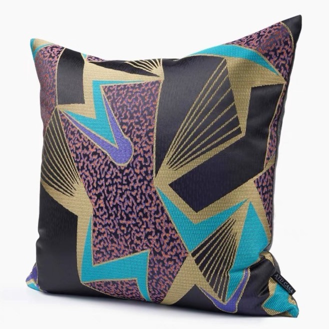 A cushion with a mix of colors black, gold, blue, purple