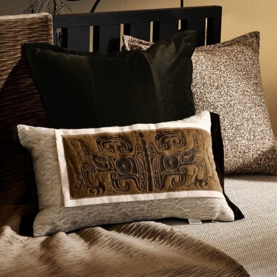 Black velvet cushion with a touch of brown