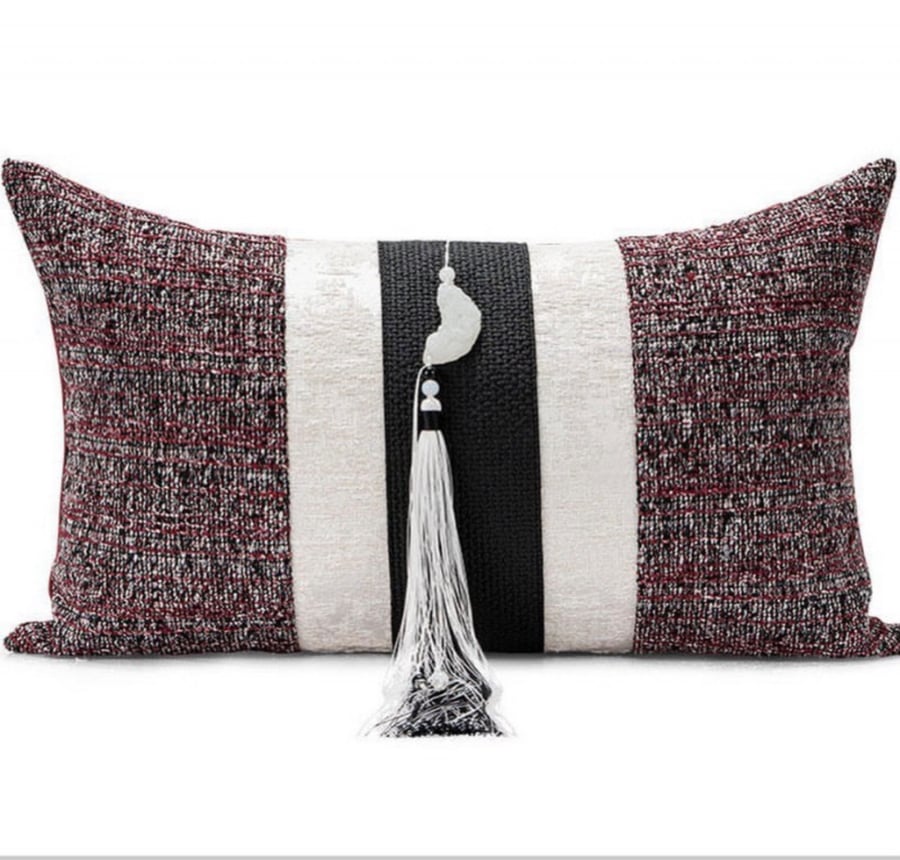 A cushion cover in maroon and black