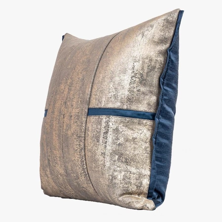 Golden velvet cushion decorated with blue