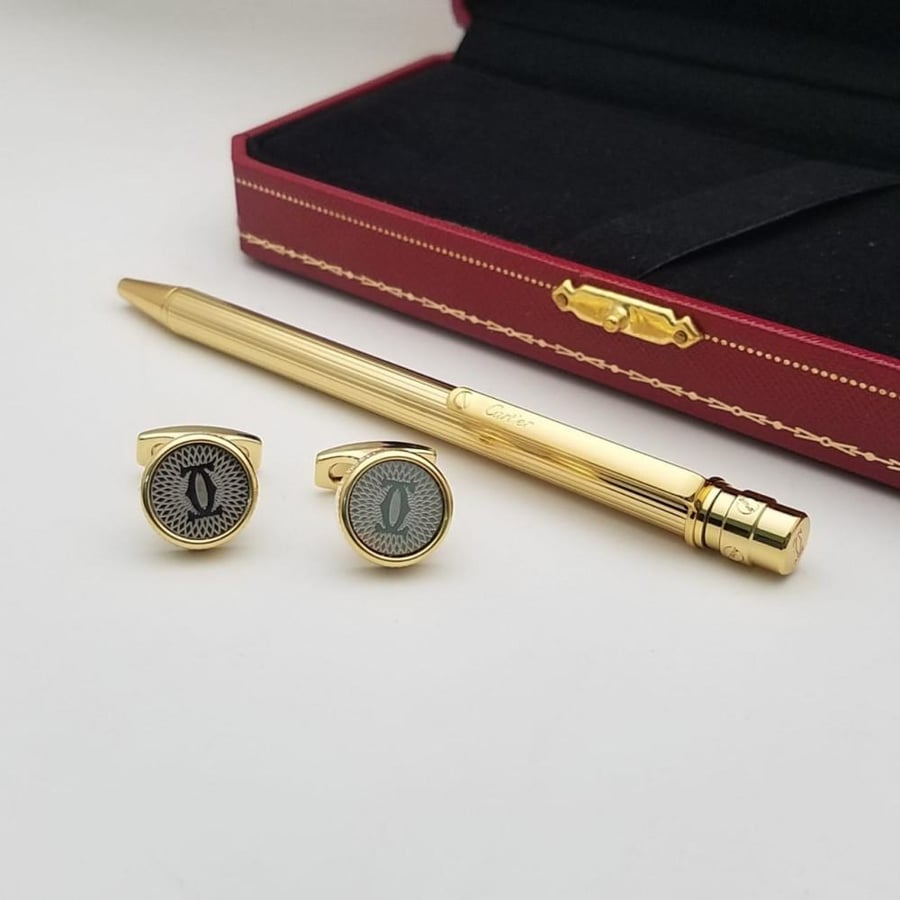 Pen and Cartier cufflink