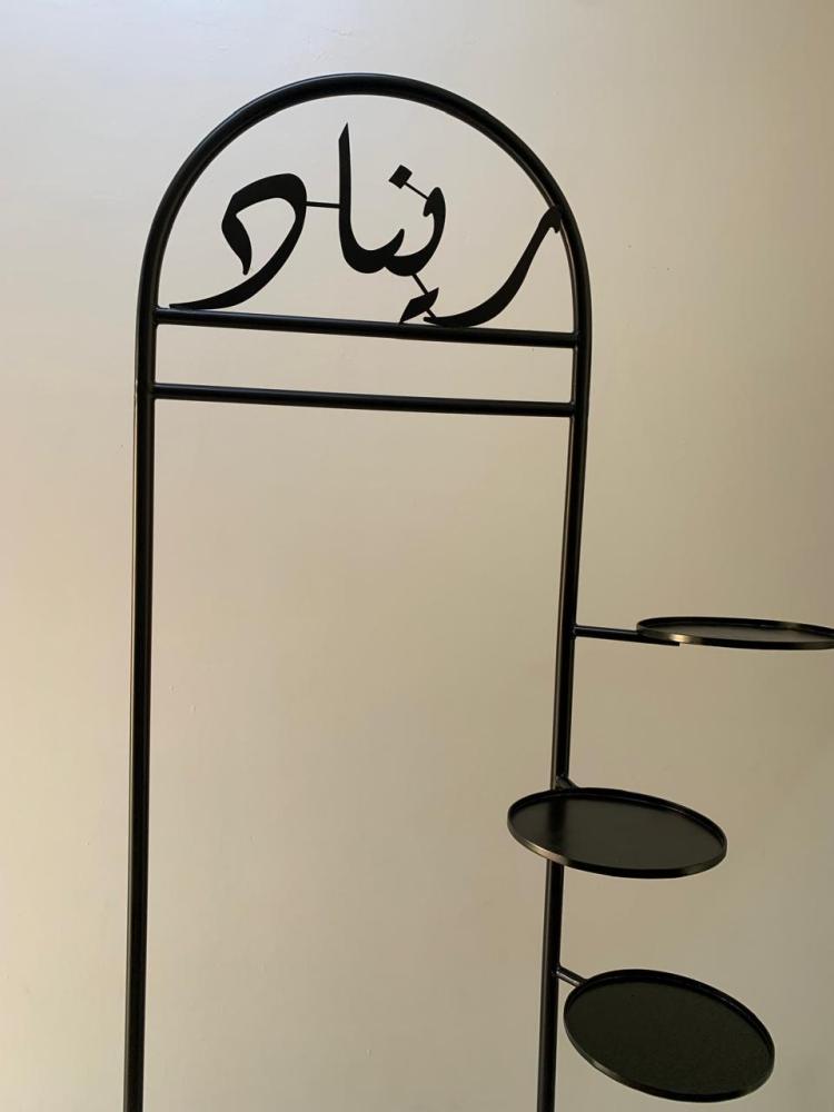 Clothing hanging stand with name writing