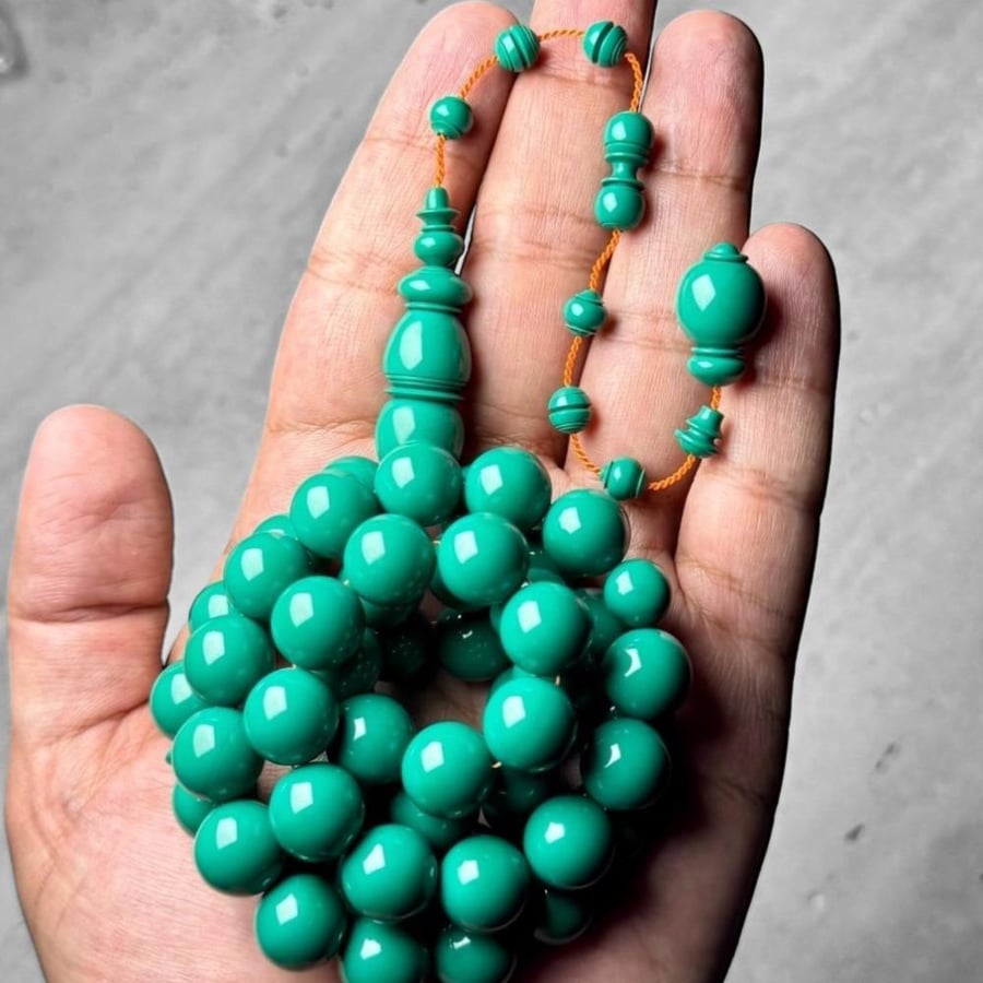 Old plastic bead bracelet, Dr. turned.