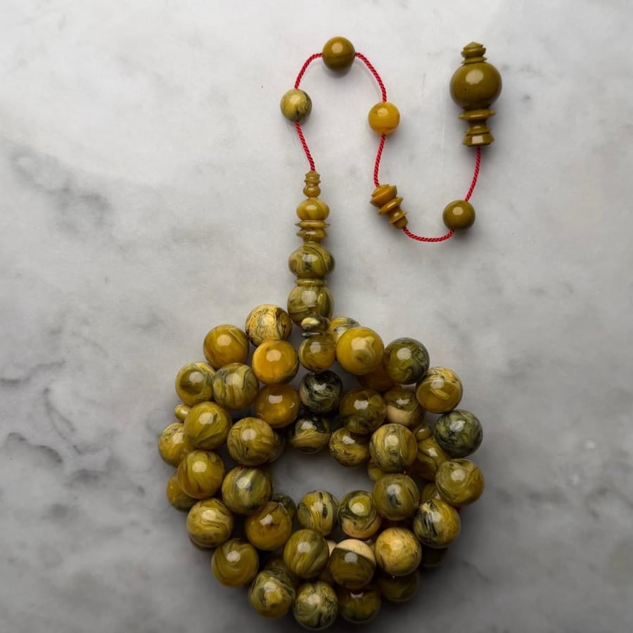 A prayer bead with a carved inlay, Jerusalem craftsmanship