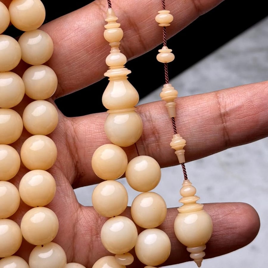 Dumana pearl prayer bead, pirate's disc engraving