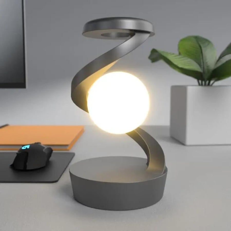 Floating LED lamp in the shape of a globe with wireless charger
