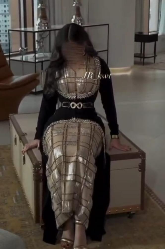 Luxurious evening dress decorated with precise computer embroidery with small squares encrusted with first-grade golden crystals, giving a luxurious and attractive shine, two pieces