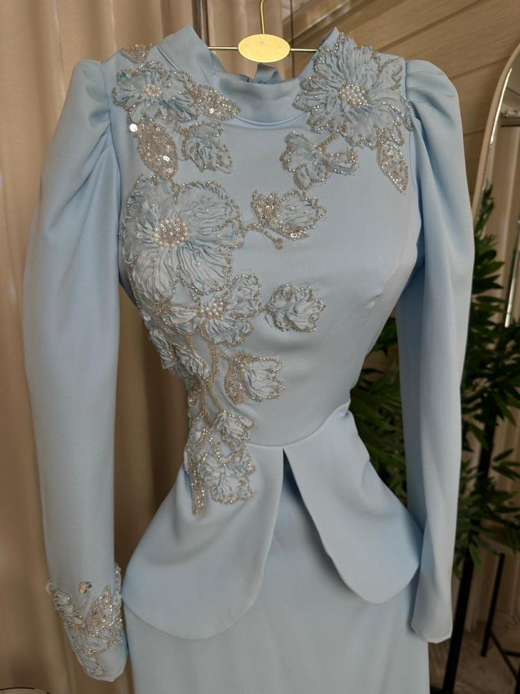Elegant evening dress made of luxurious Barbie fabric with elegant floral embroidery