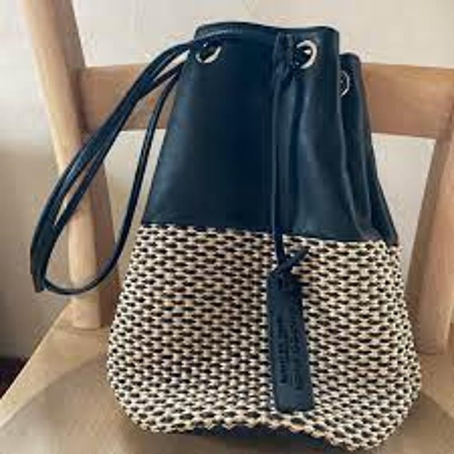 Women's fabric handbag woven with various designs