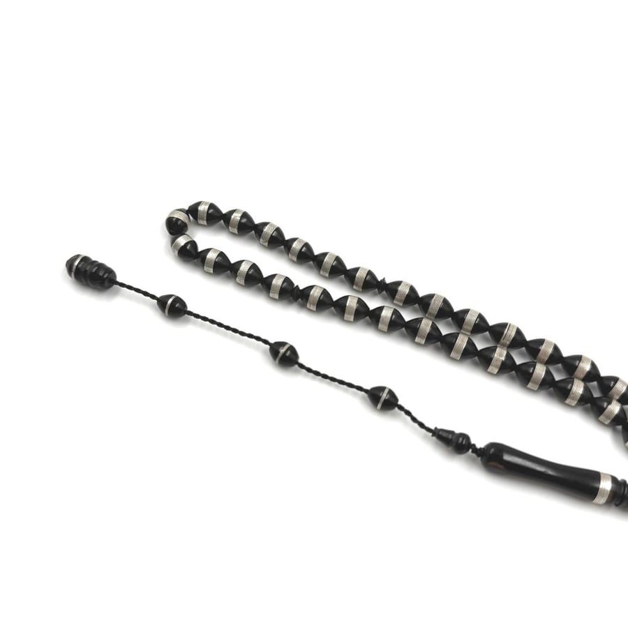 Wooden prayer beads embedded with silver