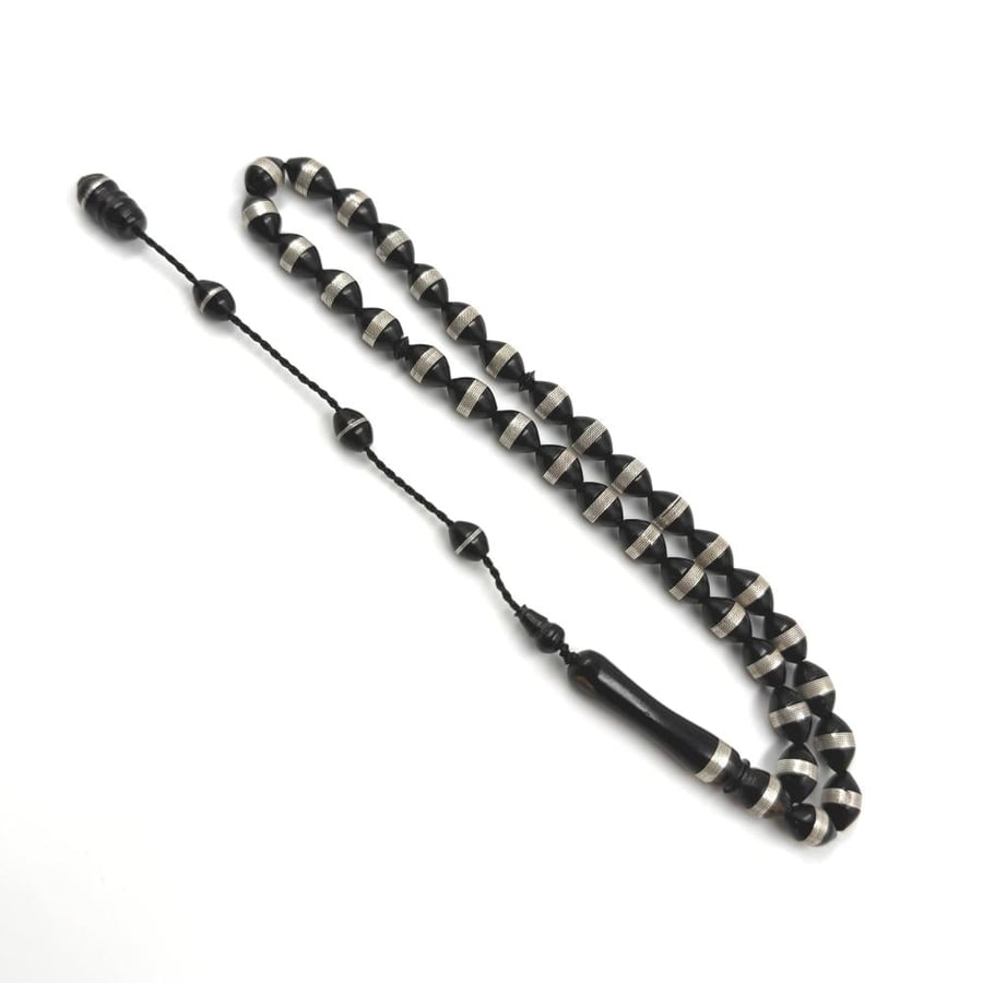 Wooden prayer beads embedded with silver