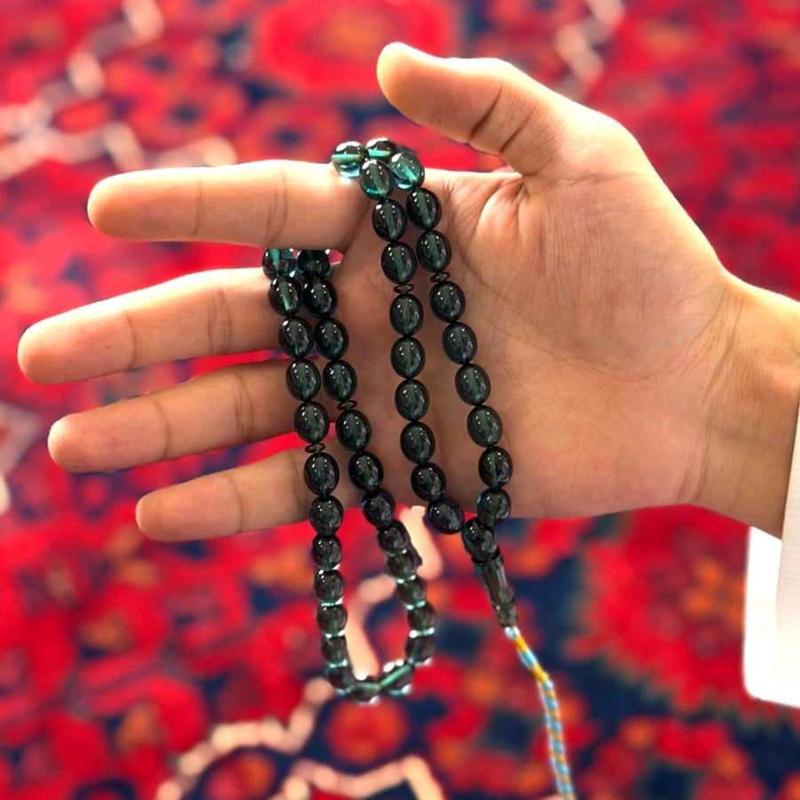 مسباح زعفراني زيتي شفاف تمليكة عدد الخرز 51