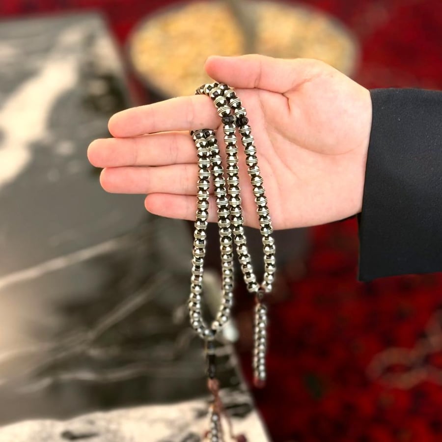 Wooden prayer beads embedded with silver