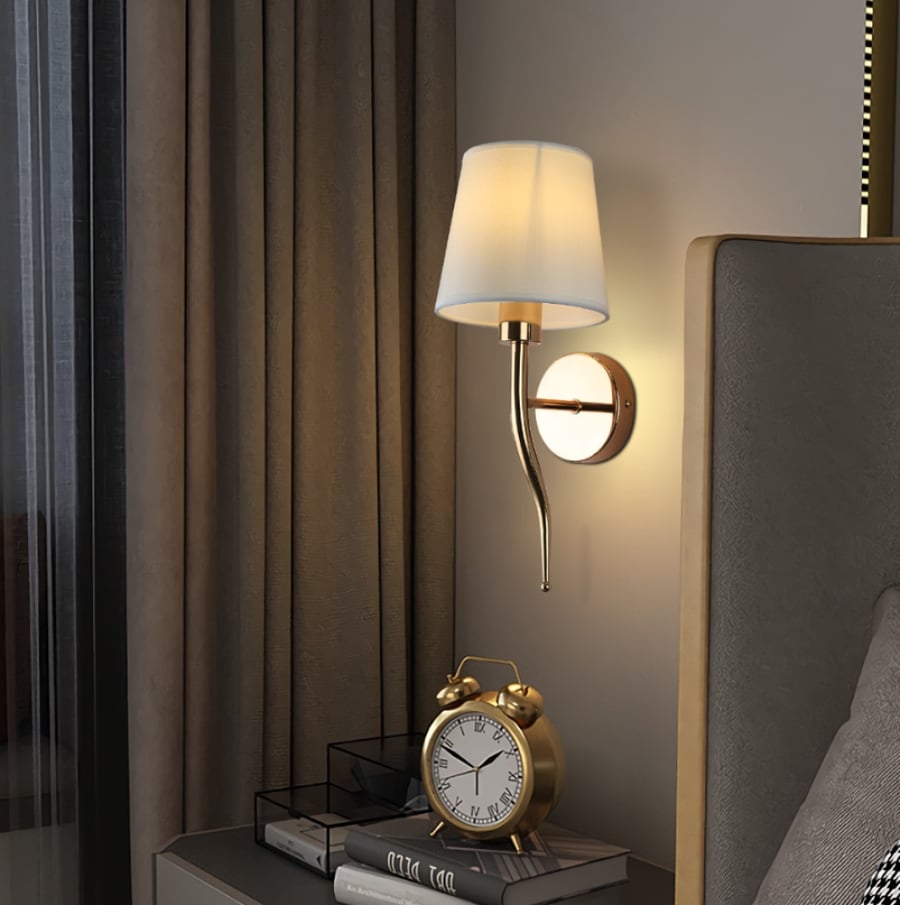 Golden wall lamp with fabric shade – classic and elegant design