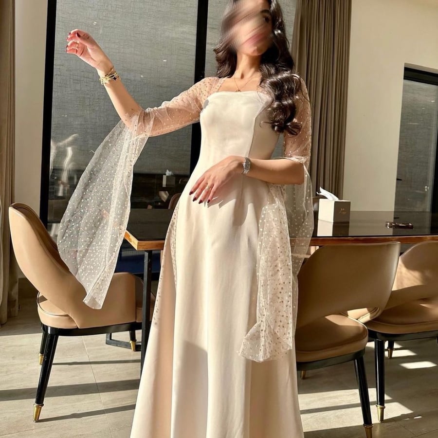 فستان سهرة باكمام طويلة شفافة