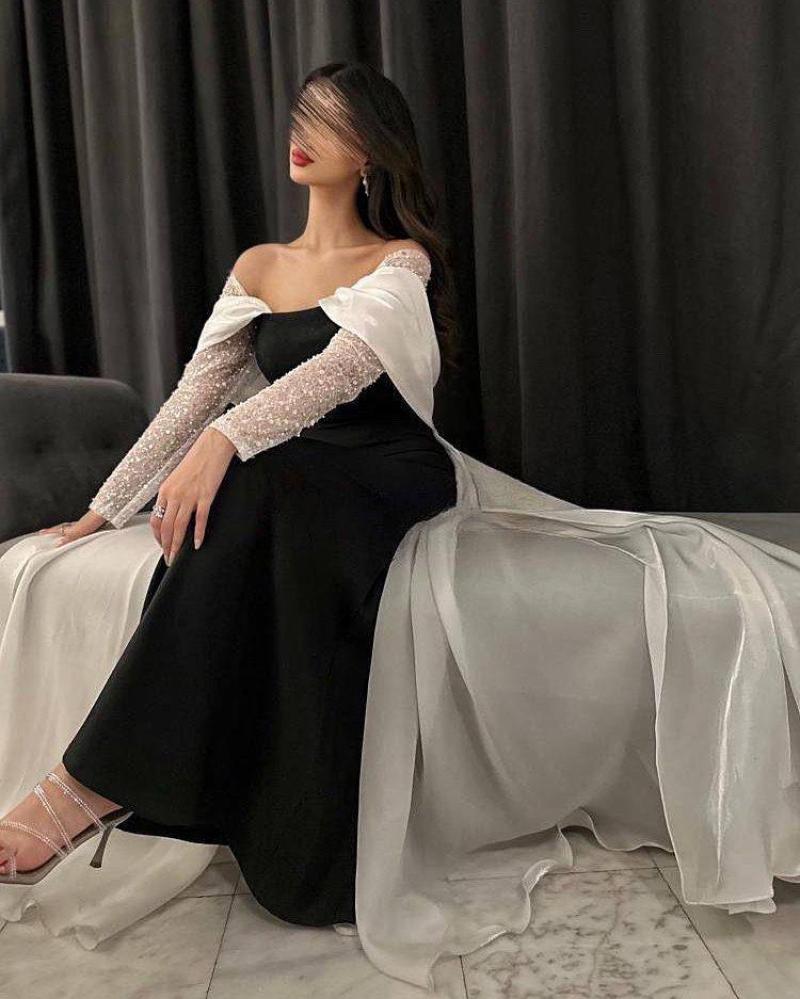 فستان سهرة اسود على أبيض اوف شولدر بقصة ذيل واكمام شفافة