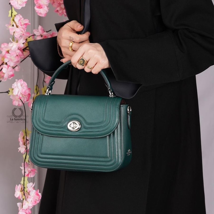 شنطة coach
