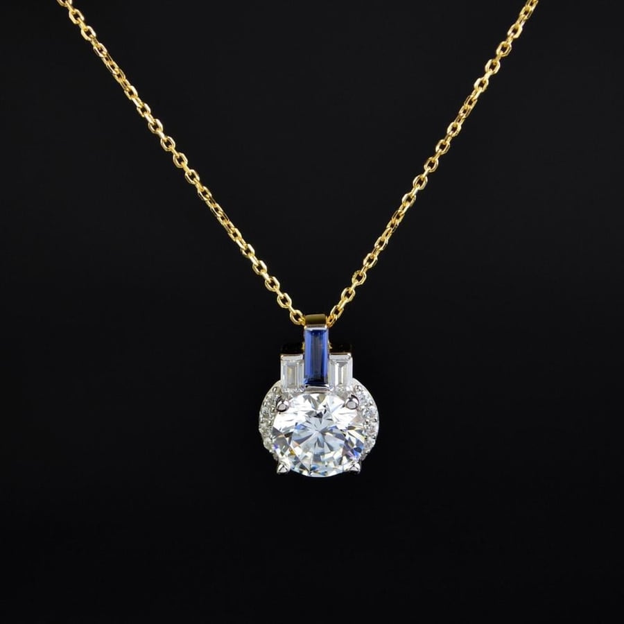 Silver pendant with white and gold zircon from Rams