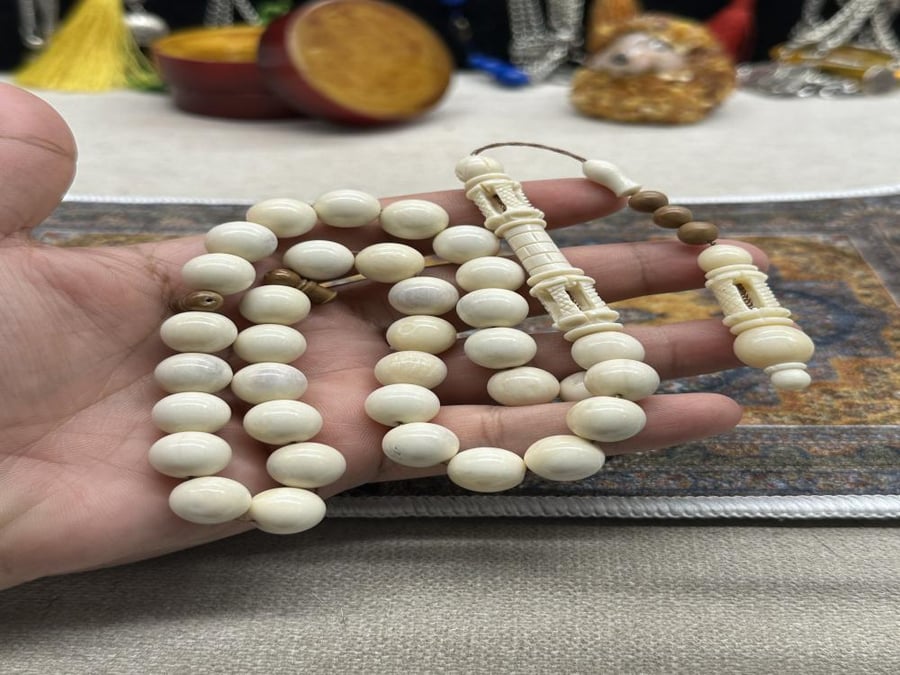 عضم جمل شاهد منحوت منارة ٣٣ خرزه ١٢ مل
