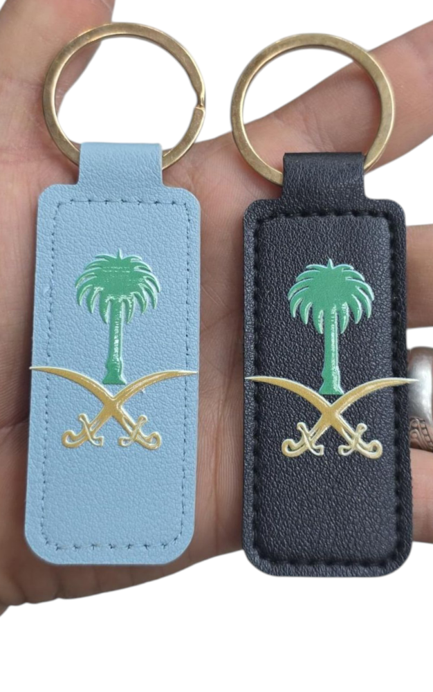 ميداليه جلد مع شعار الصيفين والنخله الدرزن 12 حبه