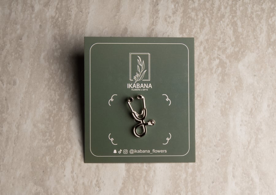 Silver doctor's stethoscope badge