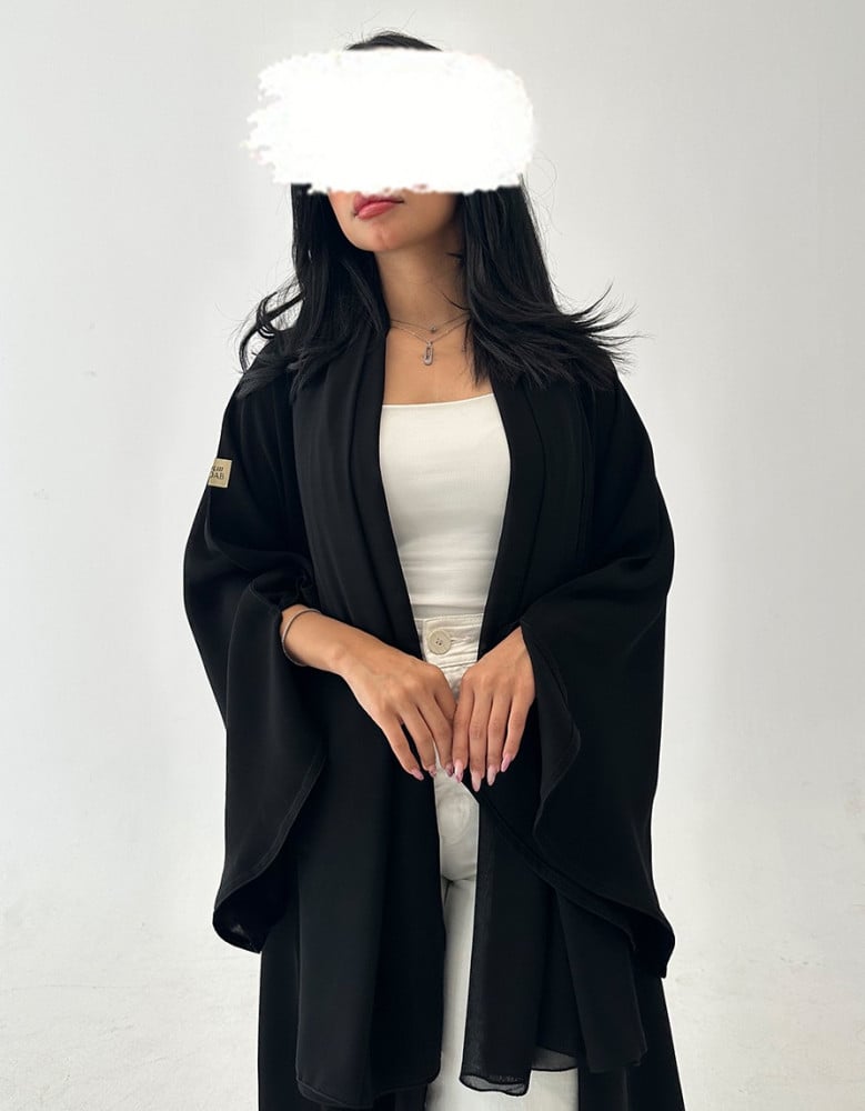 Practical black deep crepe abaya with puffed sleeves and slit