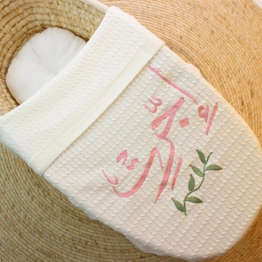 A birth blanket with name embroidery in multiple themes