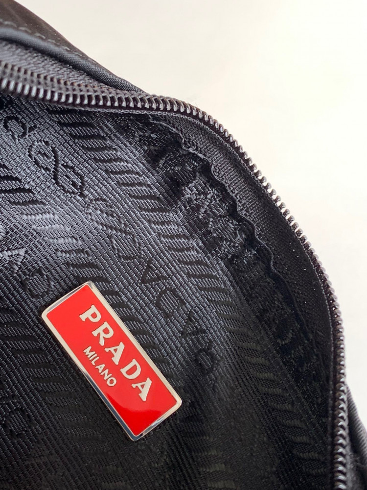 Prada logo-plaque mini bag