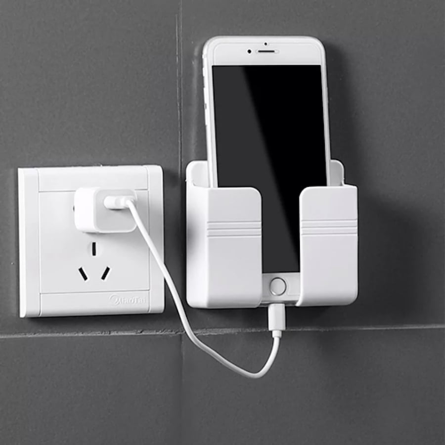 Wall-mounted phone holder with adhesive