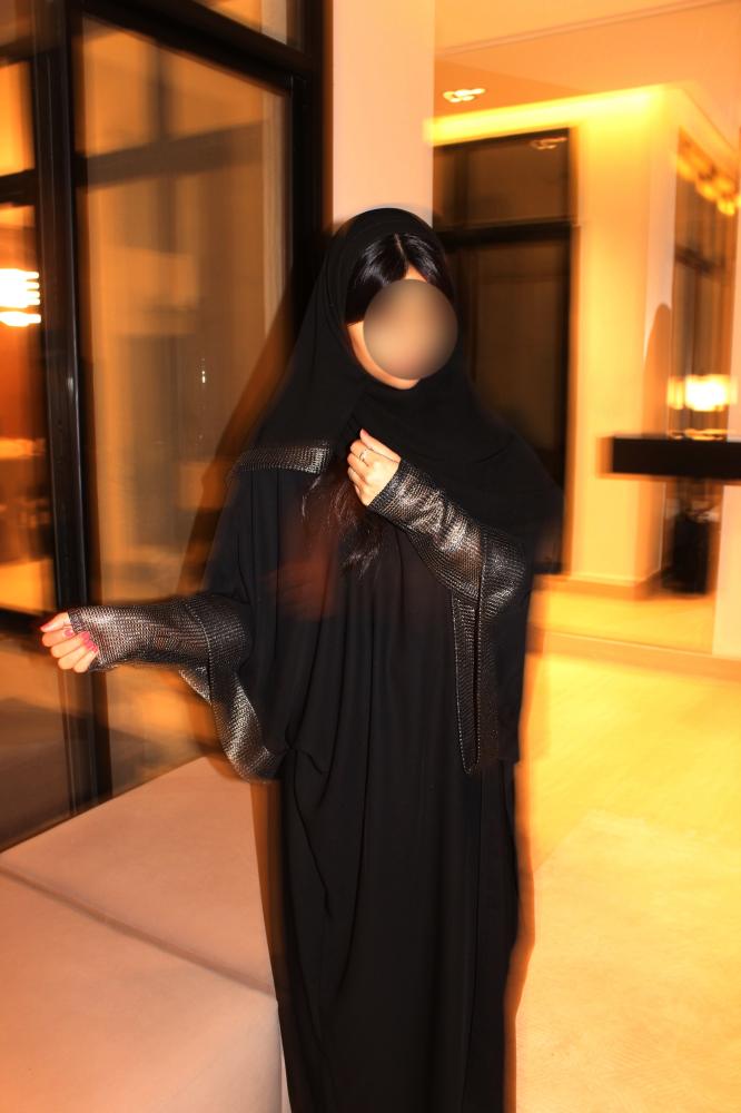 Black half bisht abaya finished with double-layered sleeves and a soft gold shimmer