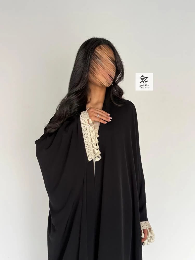 A summer abaya bisht made of soft fabric with a smooth beige trim