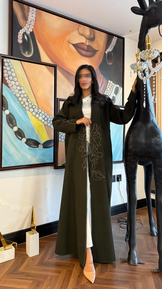 Abaya Tain with story A made of olive-colored grosgrain fabric