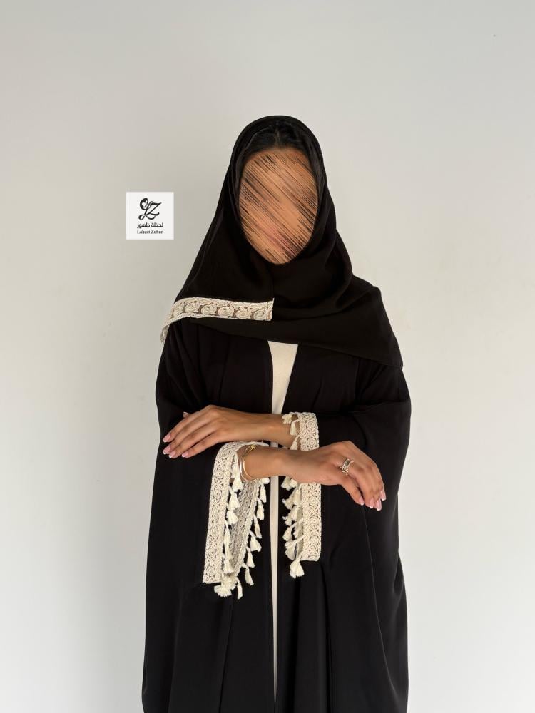 A summer abaya bisht made of soft fabric with a smooth beige trim