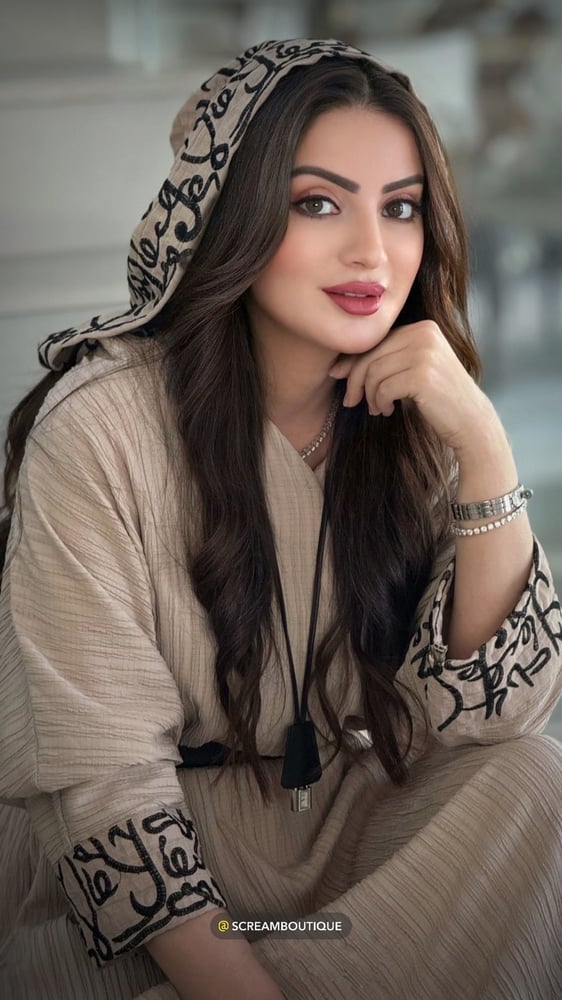 Beige overall with Arabic writing and hoodie