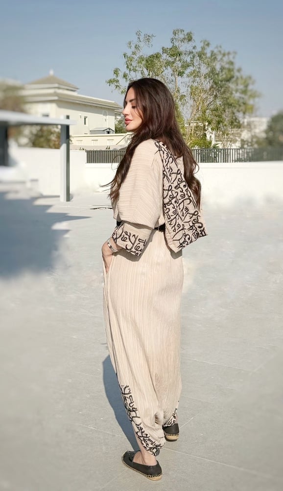 Beige overall with Arabic writing and hoodie