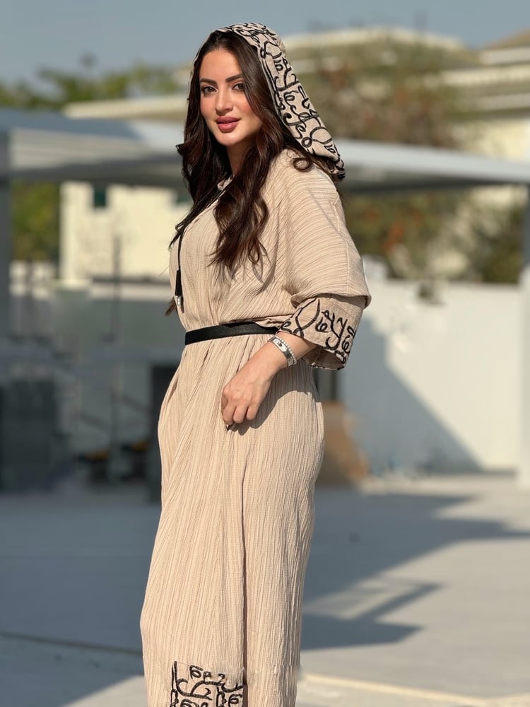 Beige overall with Arabic writing and hoodie