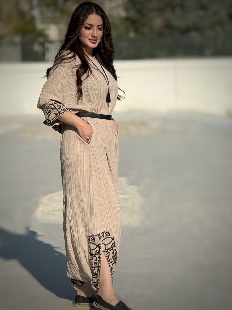 Beige overall with Arabic writing and hoodie