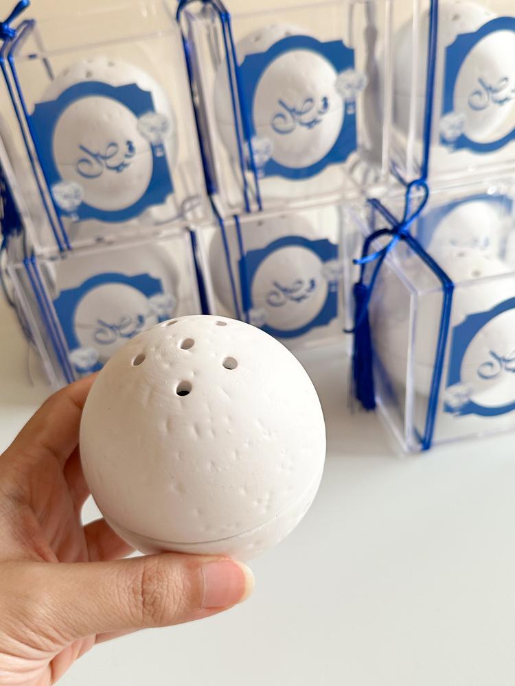 Concrete incense burners in acrylic boxes